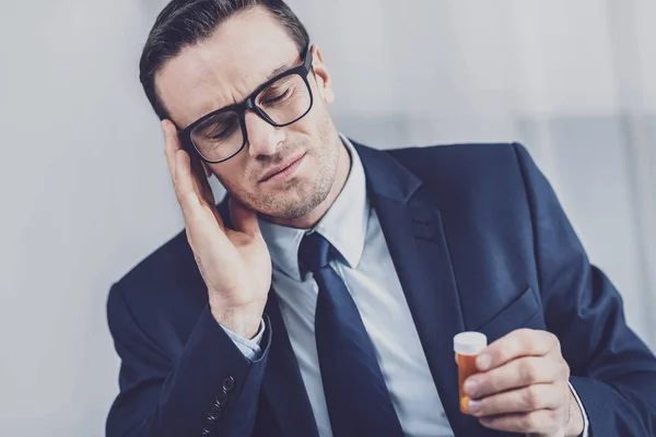 Sick businessman suffering from migraine — Stock Photo, Image