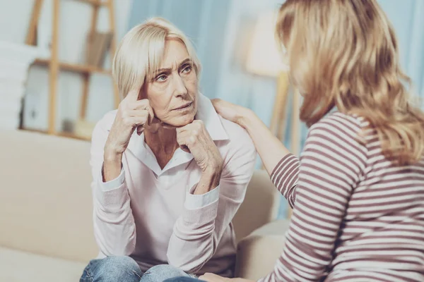 Pleasant aged woman talking to her psychologist — Stock Photo, Image