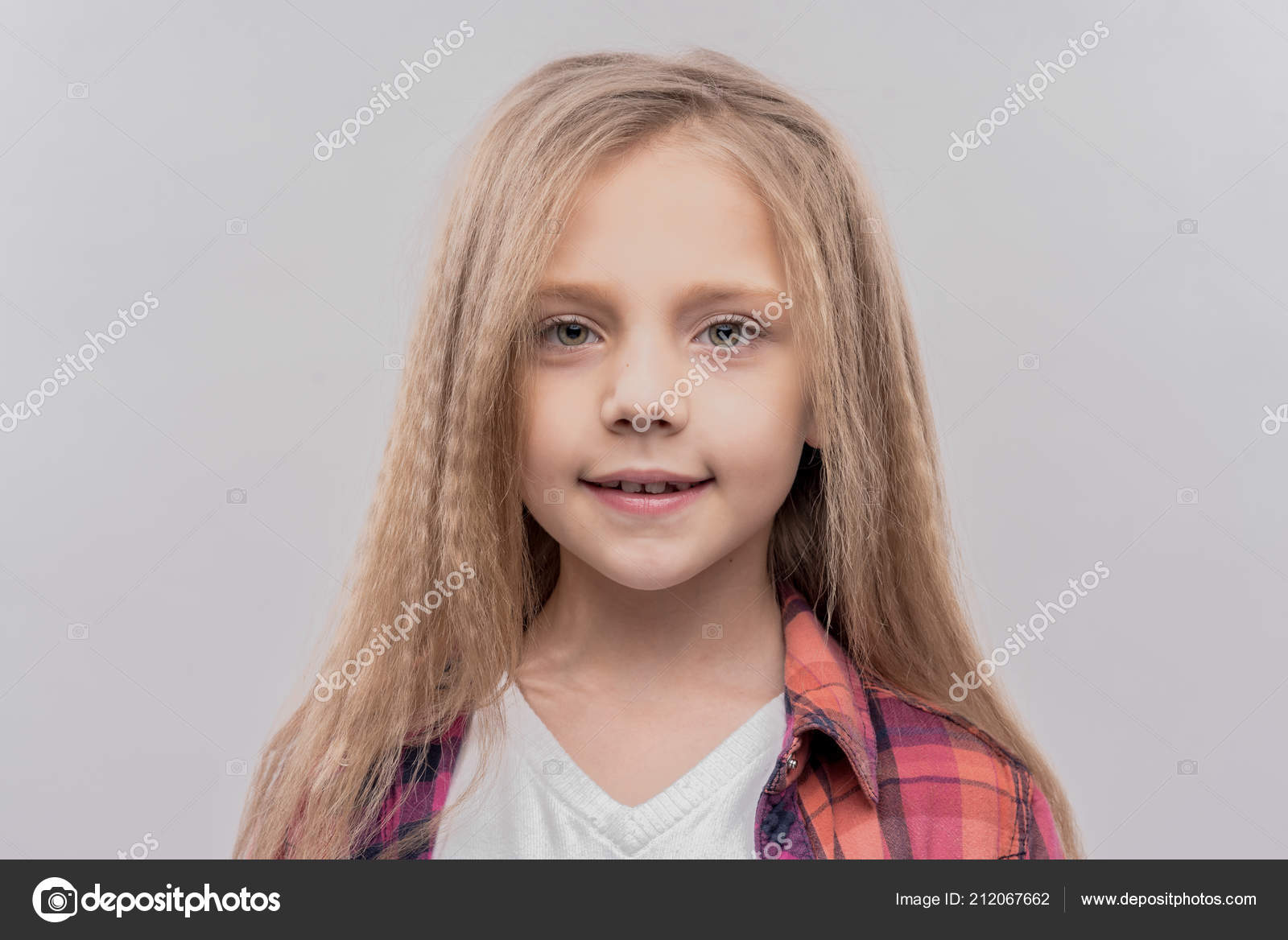 Cute blondehaired schoolgirl wearing bright squared shirt — Stock