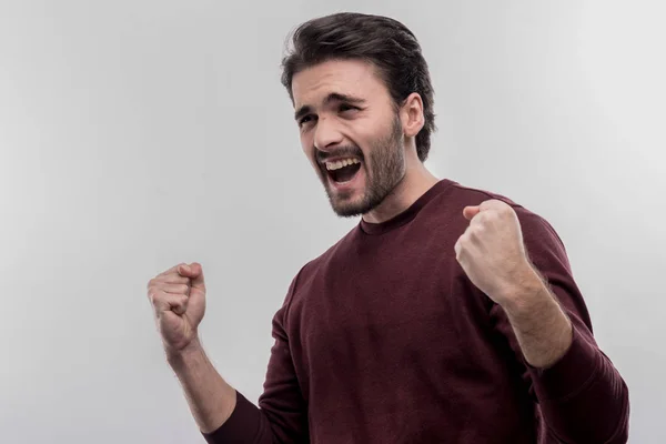 Dark-haired bearded man feeling extremely emotional after conversation — Stock Photo, Image