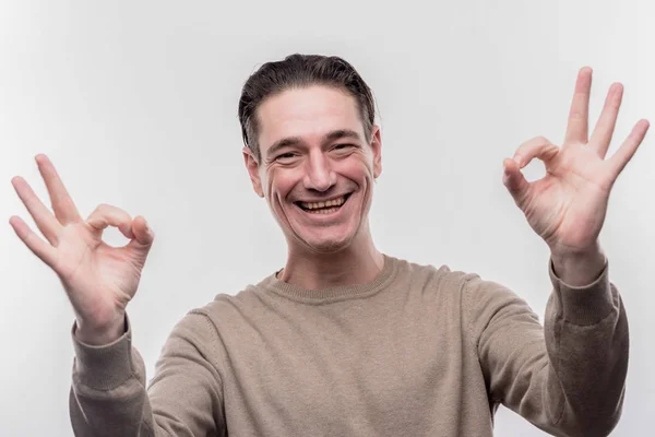 Beaming dark-haired man feeling extremely emotional and satisfied — Stock Photo, Image