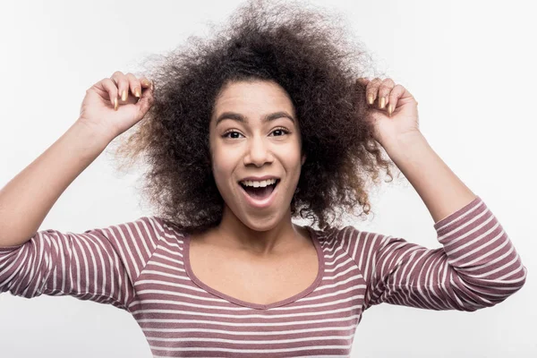 Cute curly dark-eyed woman feeling extremely surprised after some events — Stock Photo, Image