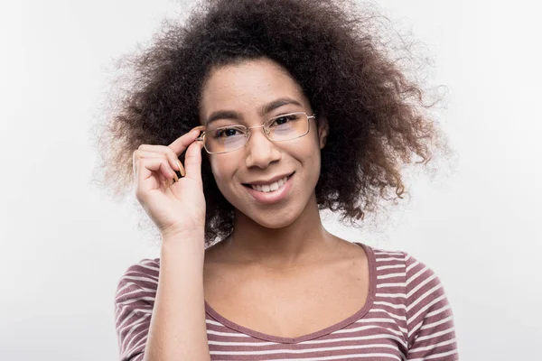 Cute curly female intern wearing glasses working very hard — Stock Photo, Image