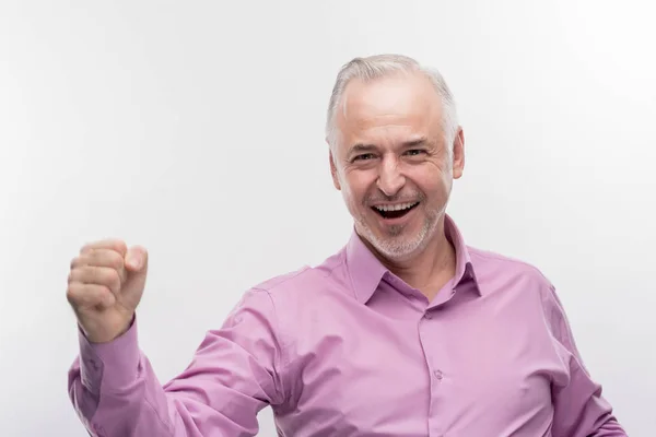 Smiling handsome aged man feeling extremely satisfied after business meeting — Stock Photo, Image