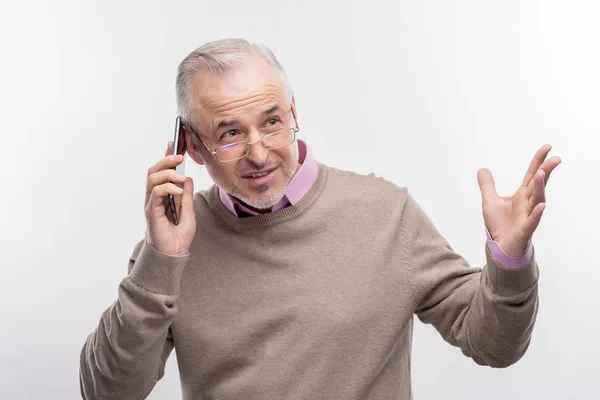 Emotional grey-haired aged man calling his business partner — Stock Photo, Image