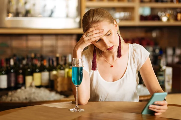 Sad depressed young woman touching her forehead — Stock Photo, Image