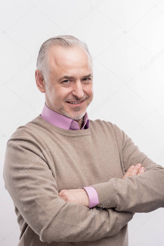 Good-looking grandfather feeling happy after visiting grandchildren