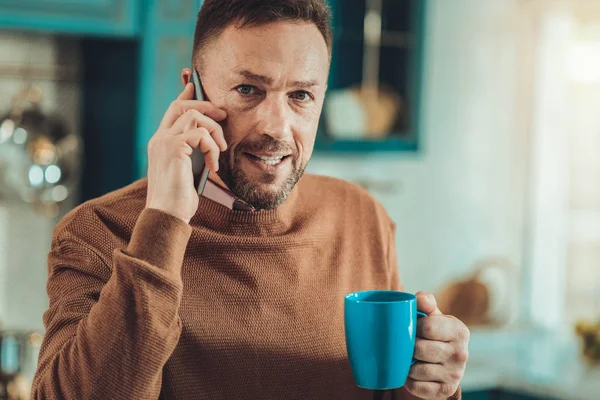 Attractive handsome man looking at you attentively — Stock Photo, Image