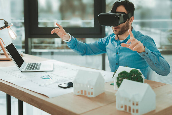 Nice pleasant man using 3d glasses