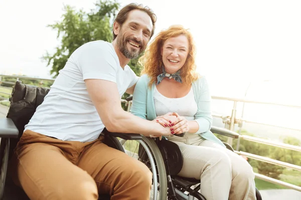 Positive minded mature couple beaming into camera — Stock Photo, Image