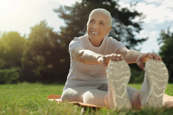 Positive minded lady enjoying exercising outdoors — Stock Photo, Image