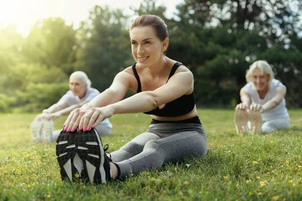Enthusiastic woman training group of retired people — Stock Photo, Image