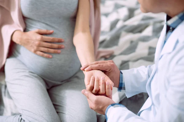 Selective focus of pregnant womans hand — Stock Photo, Image