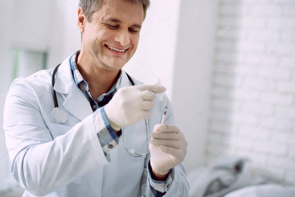 Happy cheerful doctor smiling