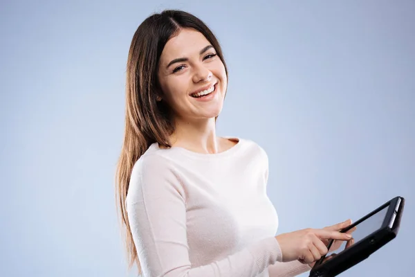 Positive delighted woman using a modern tablet — Stock Photo, Image