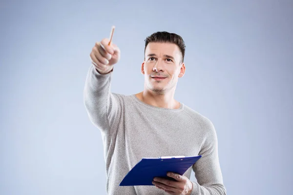 Serious smart man pointing with a pencil — Stock Photo, Image