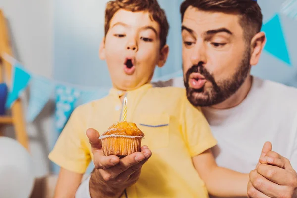 Appealing cheerful boy and man having birthday wish — Stock Photo, Image