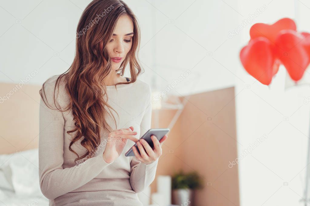 Concentrated girl sending messages to her boyfriend