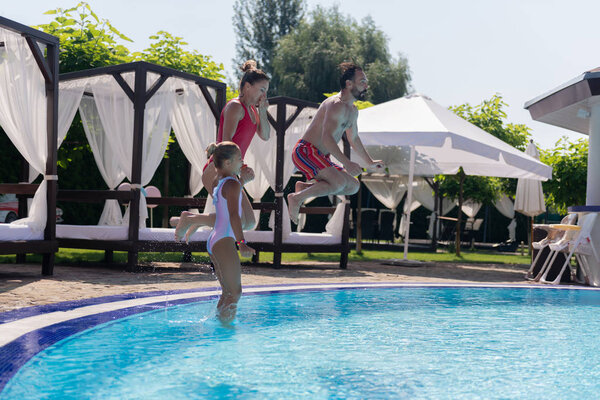 Nice joyful active family holding their breath