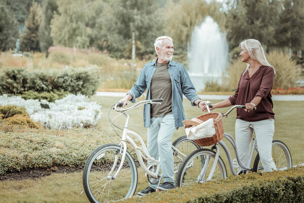Cheerful people looking at each other during walk