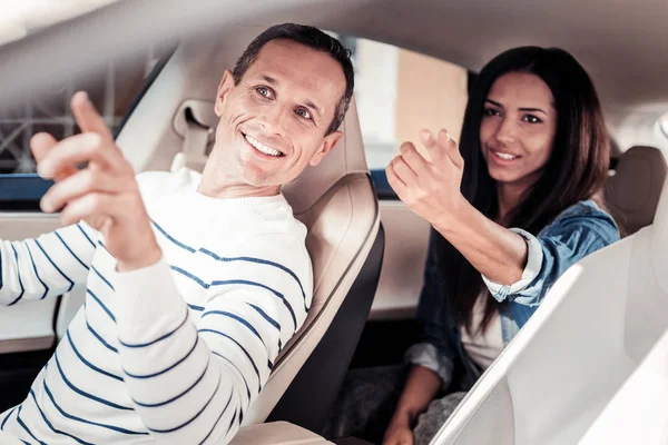 Handsome man listening to his passenger — Stock Photo, Image