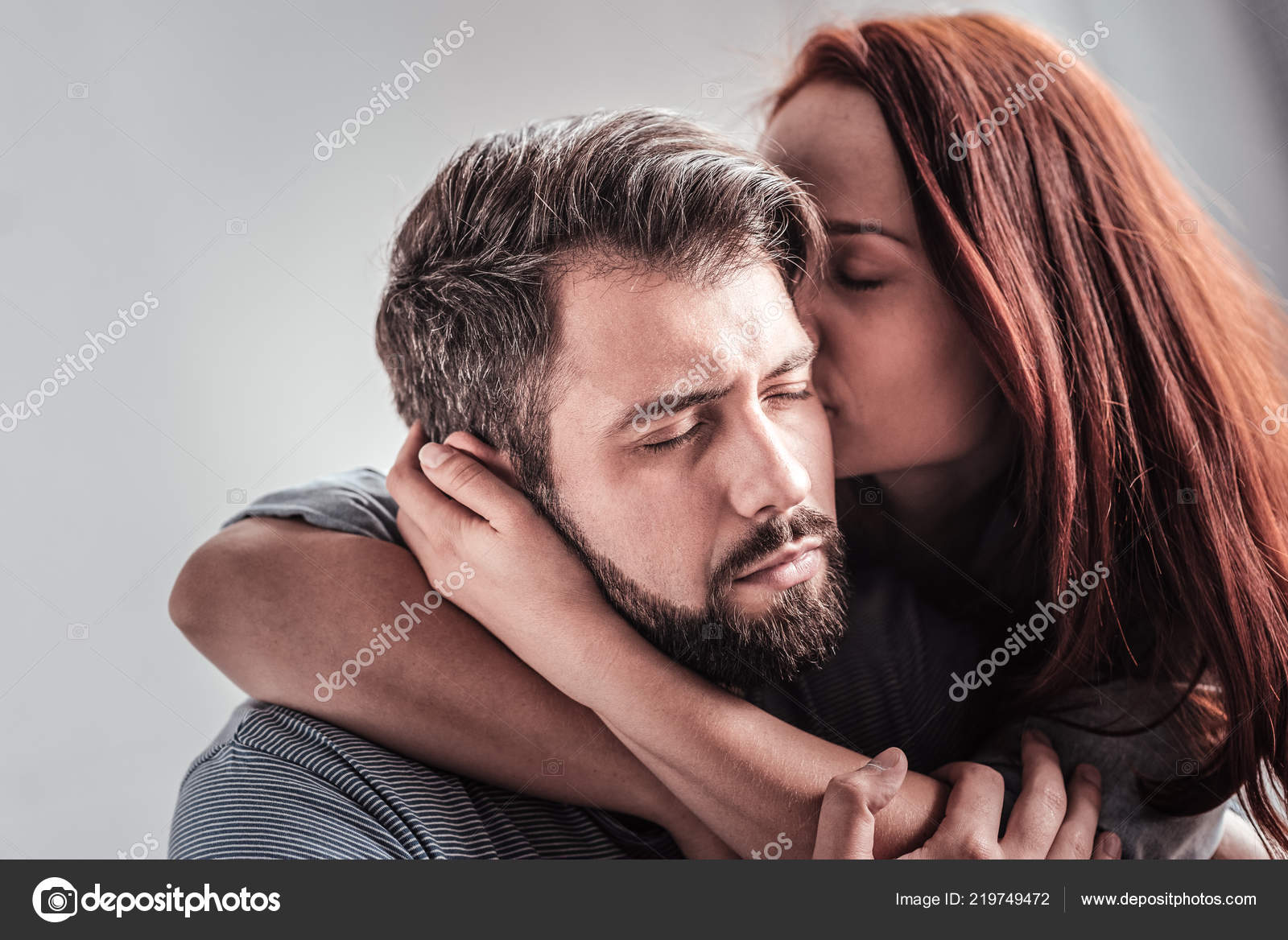 Young women kissing