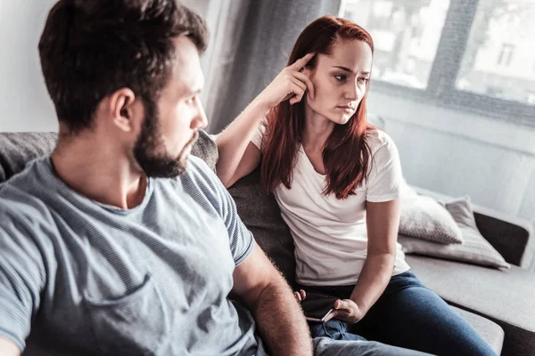 Depressed married couple sitting together — Stock Photo, Image