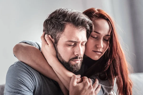 Nice beautiful woman hugging her boyfriend