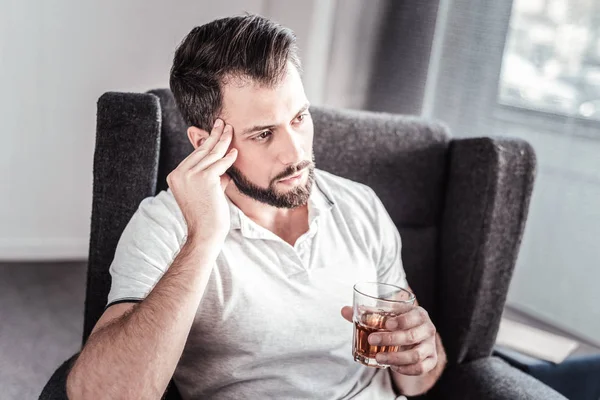 Unhappy gloomy man resting at home — Stock Photo, Image