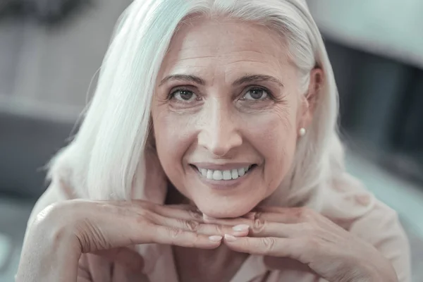 Joyful aged woman looking at you — Stock Photo, Image