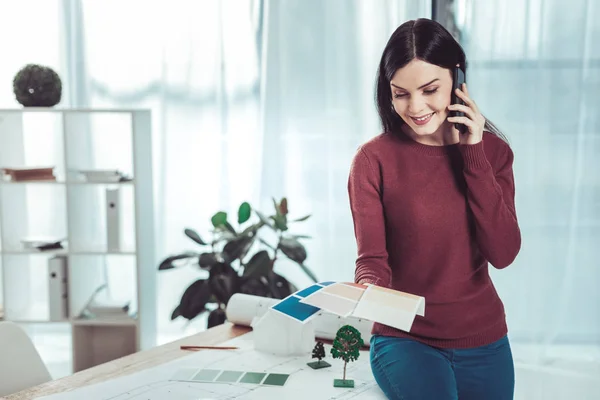 Positive delighted designer looking at color palette — Stock Photo, Image