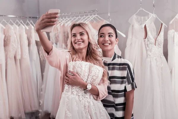 Positive nice young women smiling into the camera — Stock Photo, Image