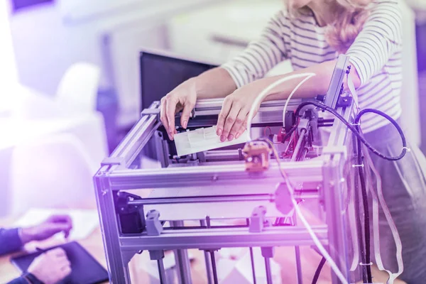 Two business workers standing near 3D printer while printing important presentation — Stock Photo, Image