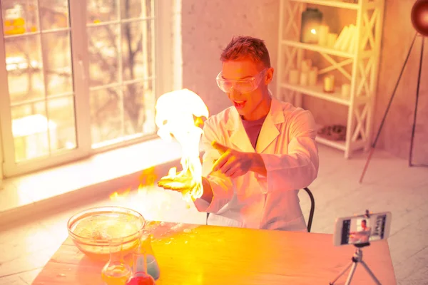 Careless terrified scientist having fire at home — Stock Photo, Image