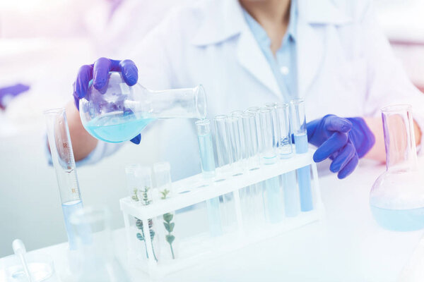 Close up of test tubes being in the rack