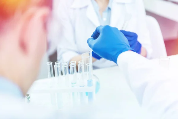 Close up of test tubes standing on the table — Stock Photo, Image