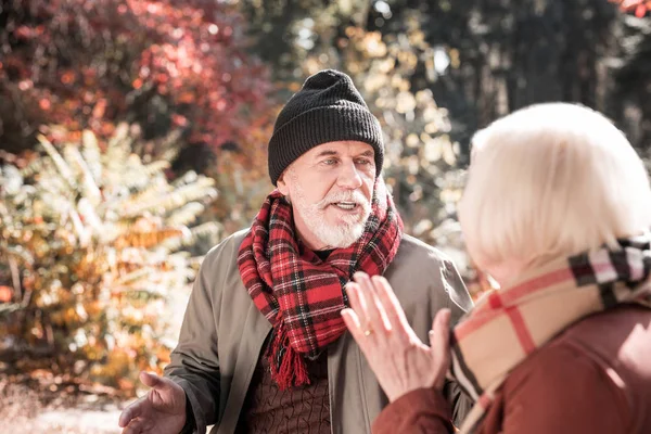 Cheerless sad man having an argument with his wife — Stock Photo, Image