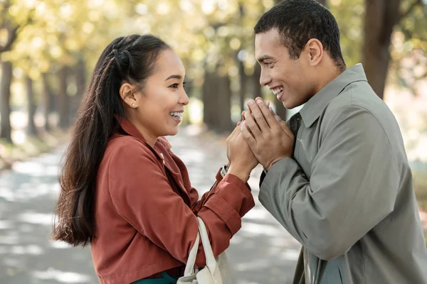 Happy Asian young people warming each other — Stock Photo, Image