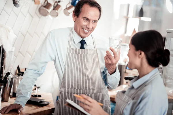 Positive nice man talking to his employee — Stock Photo, Image