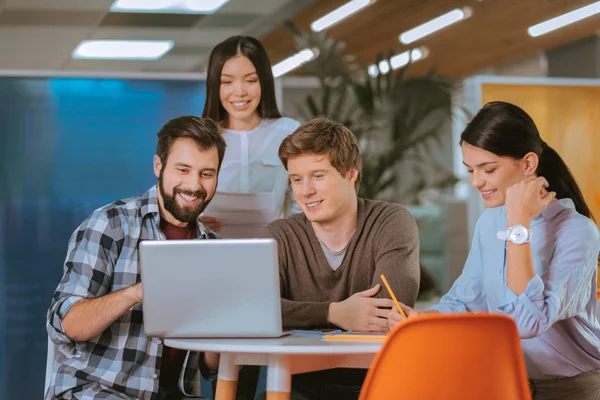 Ambitious four colleagues planning budget — Stock Photo, Image