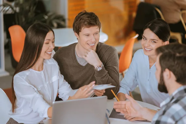 Happy four colleagues working jointly — Stock Photo, Image