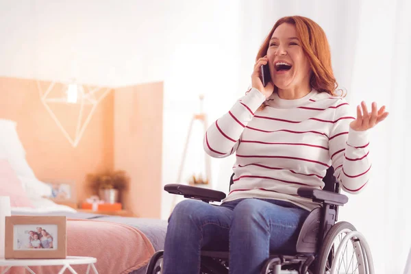 Pleasant Talk Overjoyed Nice Woman Sitting Wheelchair While Having Phone — Stock Photo, Image