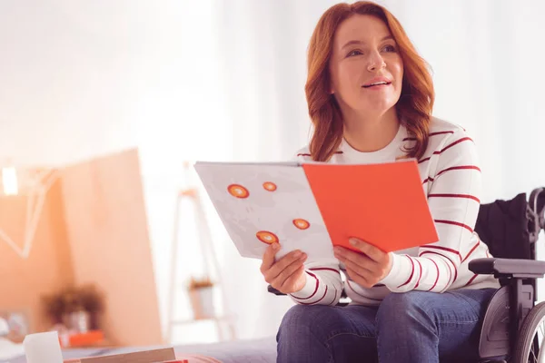 Future Planning Pleasant Disabled Woman Holding Her Notebook While Resting — Stock Photo, Image