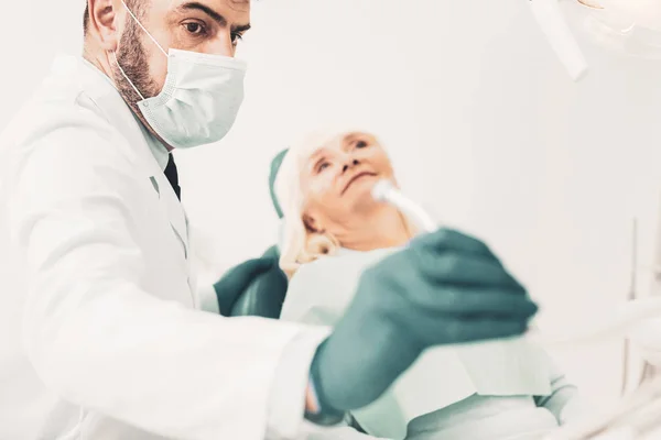 Dentist putting dental drill after work — Stock Photo, Image