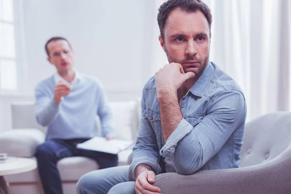 Serious displeased man being upset with consultation — Stock Photo, Image