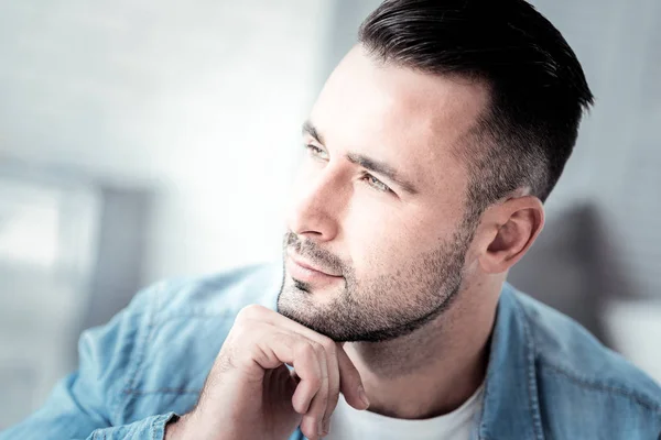Dreamy young man looking sideways — Stock Photo, Image