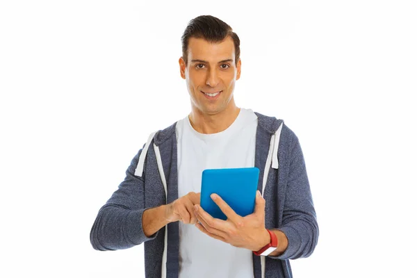 Positive joyful man using a modern technological device — Stock Photo, Image