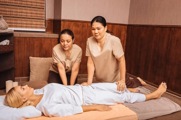 Pleasant Asian women working as masseuses in the salon — Stock Photo, Image