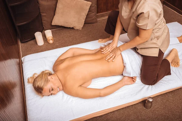 Joyful happy woman having a massage session — Stock Photo, Image