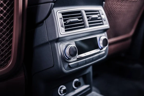 Inside the car. Close up of air conditioning and music system inside the car